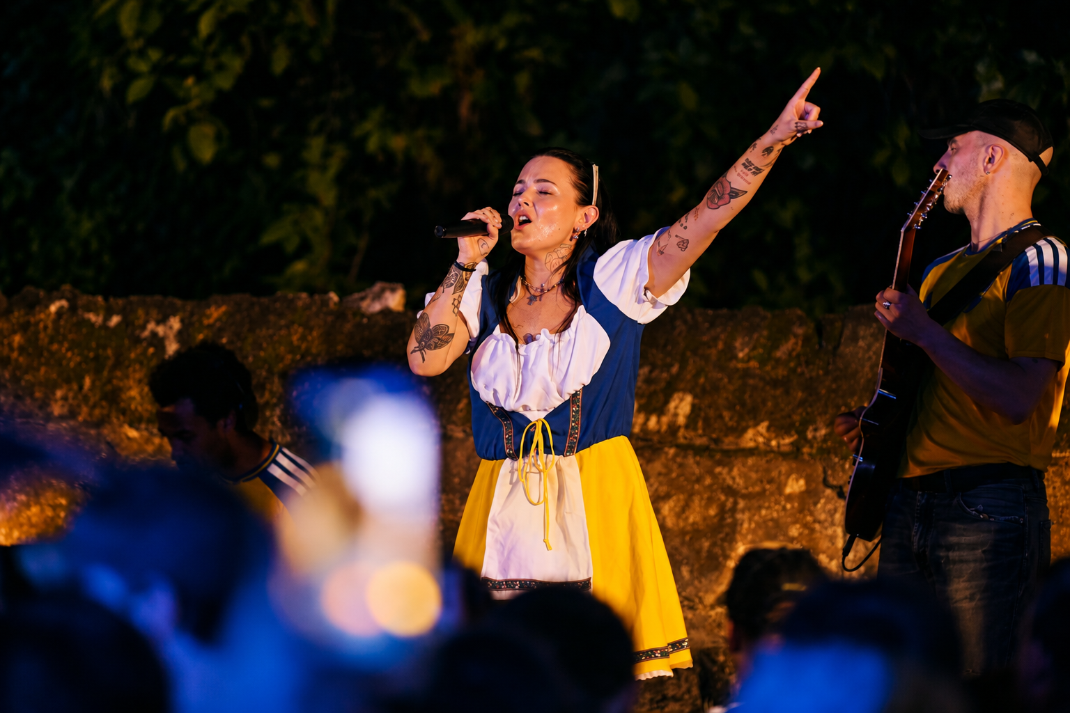 Miriam Bryant performing live in Swedish folk dress at a TILO Studios event